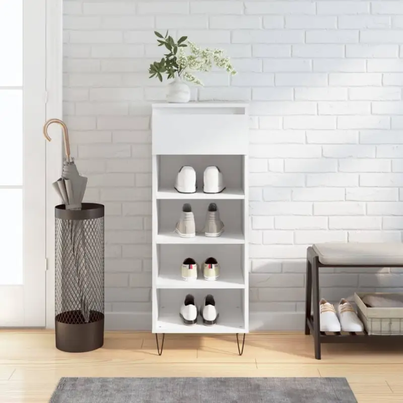 Elegante schoenenkast met bewerkt hout en metalen poten in hoogglans wit