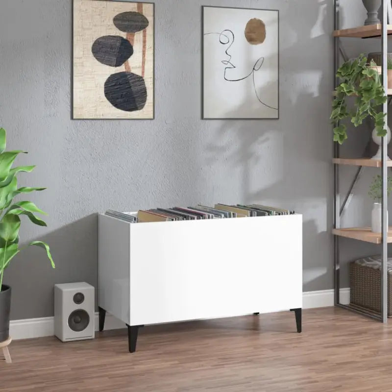 Vinylplatenkast in hoogglans wit met metalen poten en bewerkt hout